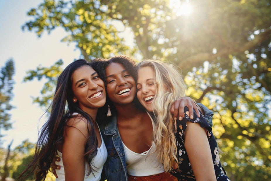 three-smiling-multiethnic-young-women-1.jpg